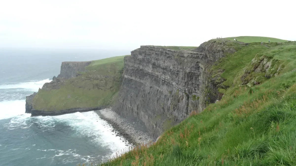 The cliffs north of O'Brien's Tower above the Atlantic surf, seen on Cliffs of Moher tours from Dublin, Ireland